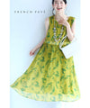 A refreshing yellow-green leaf patterned mid-length dress