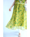 A refreshing yellow-green leaf patterned mid-length dress