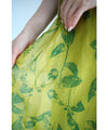 A refreshing yellow-green leaf patterned mid-length dress