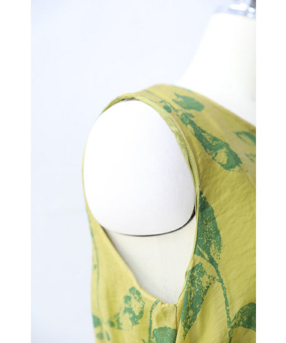 A refreshing yellow-green leaf patterned mid-length dress