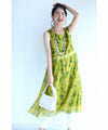 A refreshing yellow-green leaf patterned mid-length dress