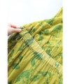 A refreshing yellow-green leaf patterned mid-length dress