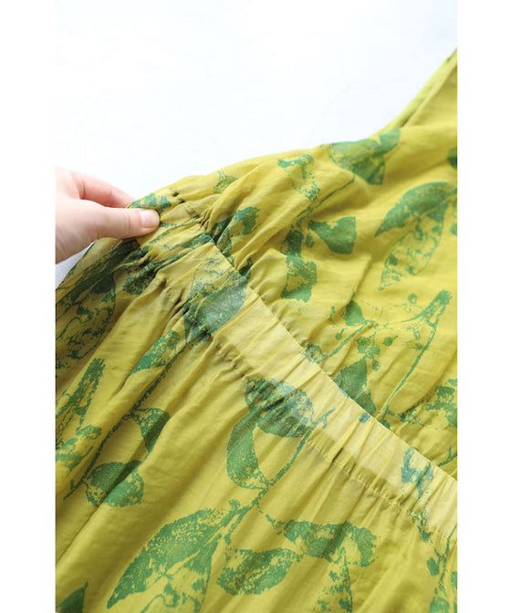 A refreshing yellow-green leaf patterned mid-length dress