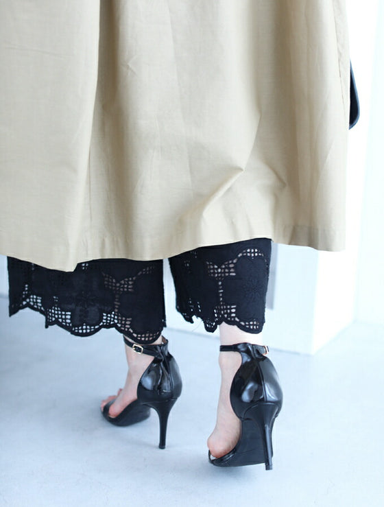 Wide pants with floral embroidery to wear under a dress