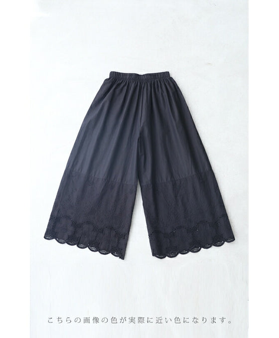 Wide pants with floral embroidery to wear under a dress