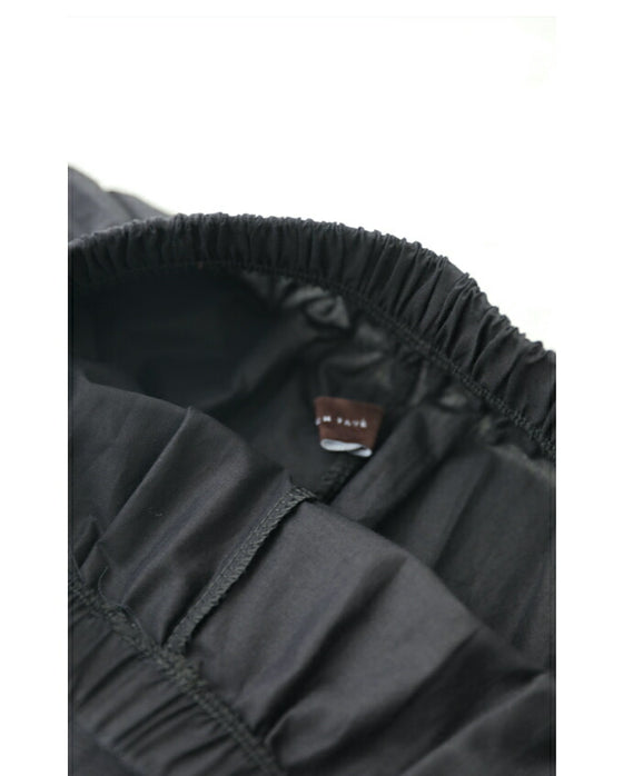 Wide pants with floral embroidery to wear under a dress