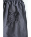 Wide pants with floral embroidery to wear under a dress