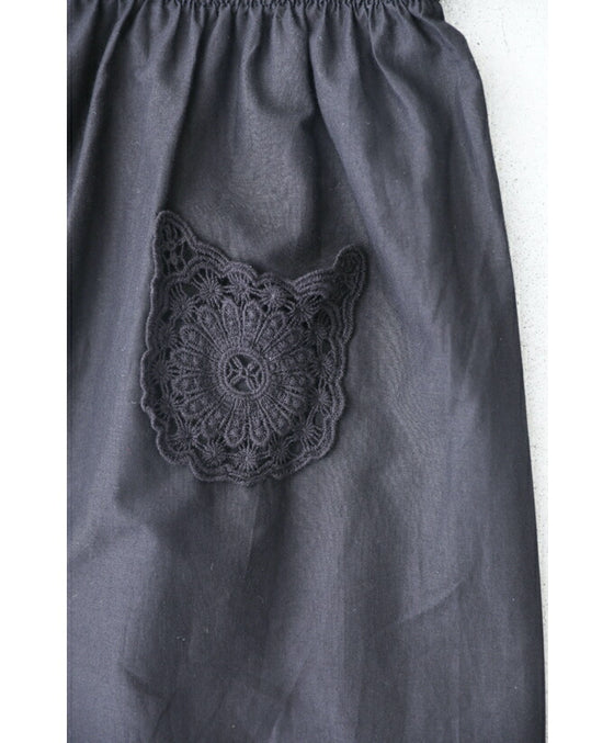 Wide pants with floral embroidery to wear under a dress