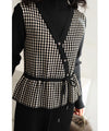 Peplum medium dress with a layered vest look