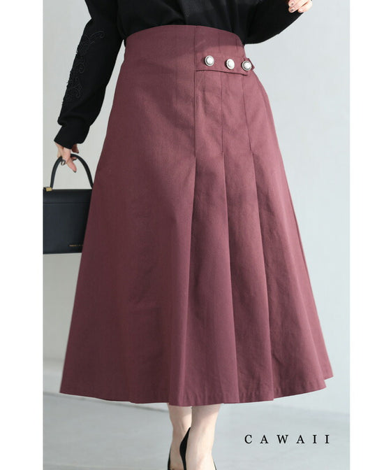 パールボタン連なるアシンメトリープリーツミディアムスカート