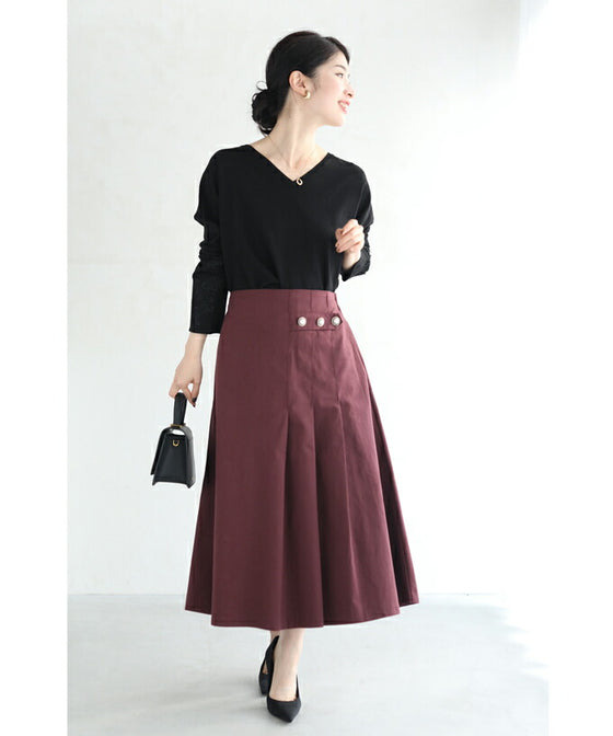 パールボタン連なるアシンメトリープリーツミディアムスカート