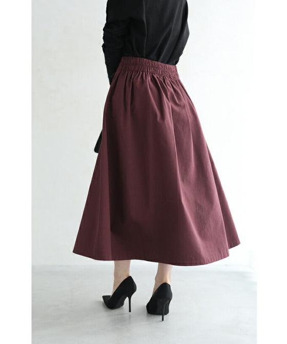 パールボタン連なるアシンメトリープリーツミディアムスカート