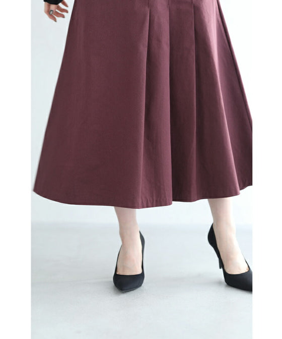 パールボタン連なるアシンメトリープリーツミディアムスカート