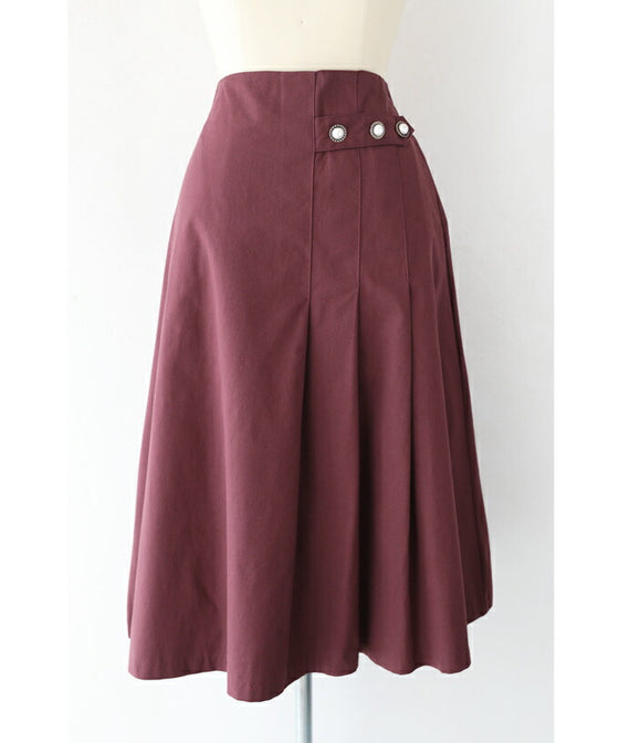 パールボタン連なるアシンメトリープリーツミディアムスカート