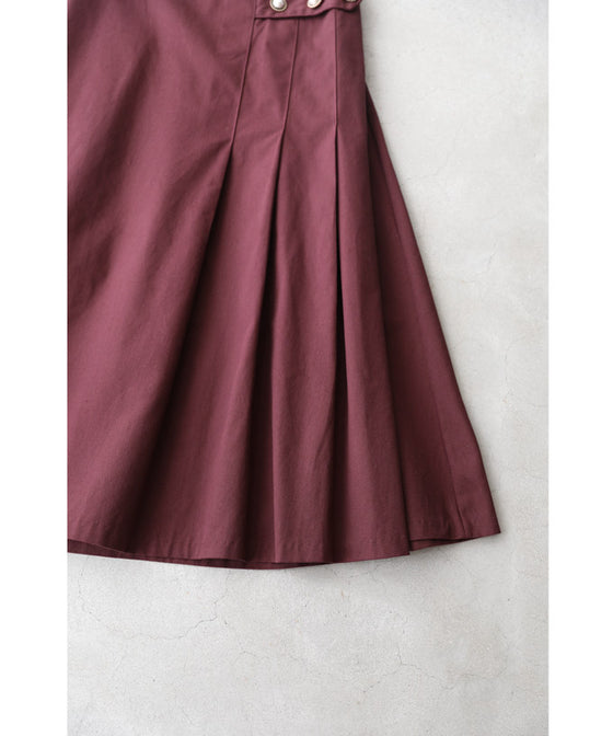 パールボタン連なるアシンメトリープリーツミディアムスカート