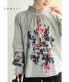 A rose blouse top with an antique feel