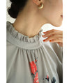 A rose blouse top with an antique feel