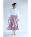 A pleated midi skirt with a fluttering design