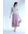 A pleated midi skirt with a fluttering design