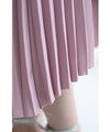 A pleated midi skirt with a fluttering design
